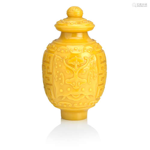 Bearing Qianlong four-character mark A Peking carved yellow glass vase and cover