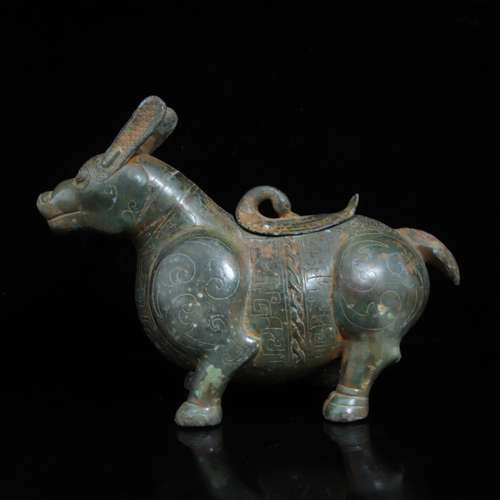 A COPPER COW SHAPED STATUE