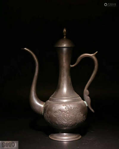 A CARVED FLORAL PATTERN SILVER MOLDED EWER