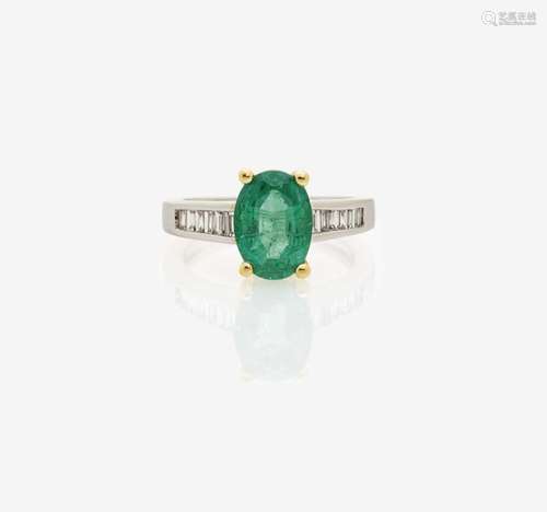 AN EMERALD AND DIAMOND SET RING England, 1990-2000