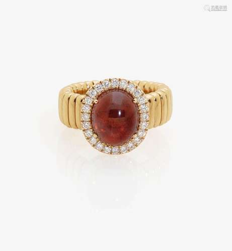 A SPESSARTINE AND DIAMOND SET RING