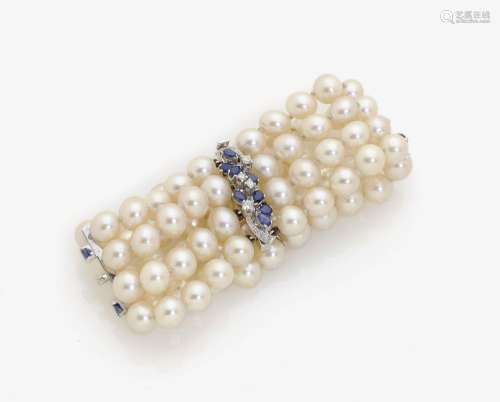 A FOUR-STRAND AKOYA CULTURED PEARL BRACELET SET WITH DIAMONDS AND SAPPHIRES Germany, 1970s