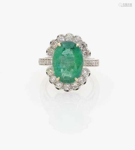 AN EMERALD AND DIAMOND RING