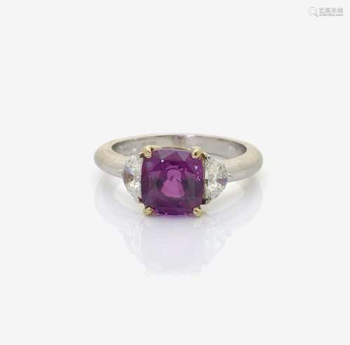 A PURPLISH-PINK SAPPHIRE AND DIAMOND SET RING England, London, 1983