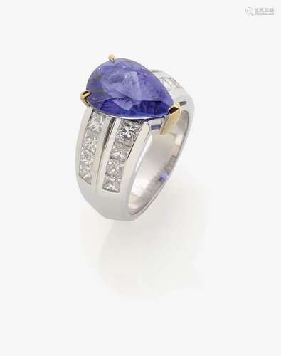 A TANZANITE AND DIAMOND RING