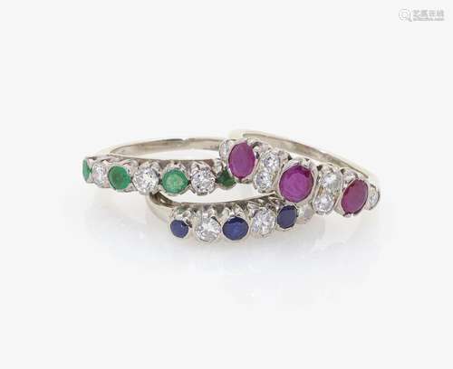 THREE RIVIÈRE RINGS WITH RUBIES, SAPPHIRES, EMERALDS AND DIAMONDS Germany, 1950s-1960s