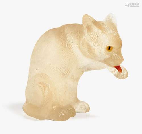 A CARVED YELLOW BERYL FIGURE OF A CAT PREENING ITSELF Germany, Idar-Oberstein, 1980s, BERNHARD BECKER