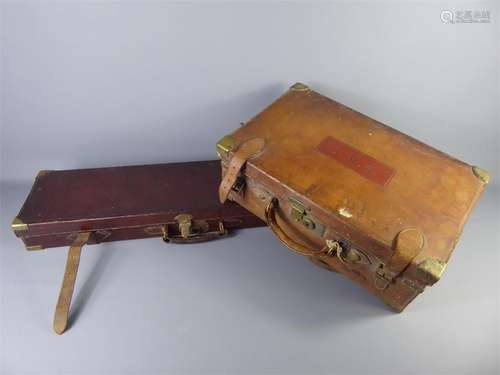 A Vintage Leather Cartridge Case approx 47 x 30 x 17 cms together with a brass edged Gun Case