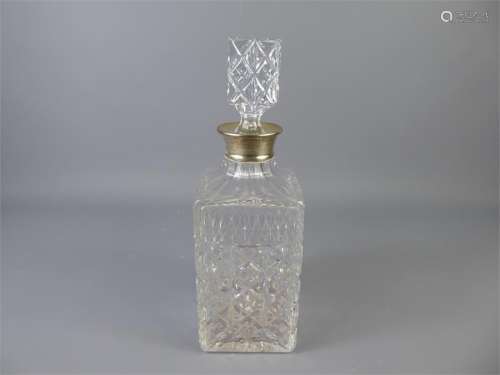 A Silver-Topped Cut-Glass Decanter