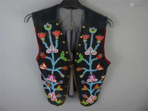 A Late 19th Century North American Ojibwe Native American Velvet Floral Beaded Waistcoat. The vest given to a Doctor in Montreal in 1928