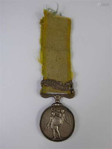 A Crimea Sebastopol Clasp Medal awarded to Lt.Colonel Robert Dillon of the 30th Regiment