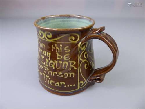 A Novelty Studio Pottery Slip-Ware Real Ale 'Cleric' Mug with blue frog inside