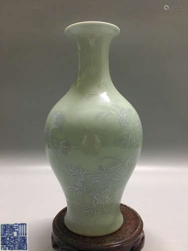 A DOUQING CELADON FLORAL AND BIRD PATTERN VASE