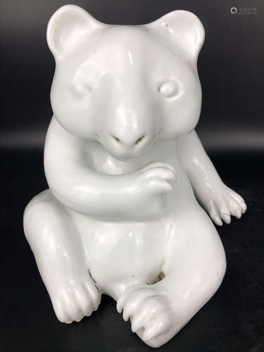 A PORCELAIN BEAR SHAPED STATUE