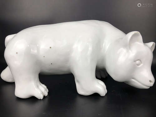 A PORCELAIN BEAR SHAPED STATUE