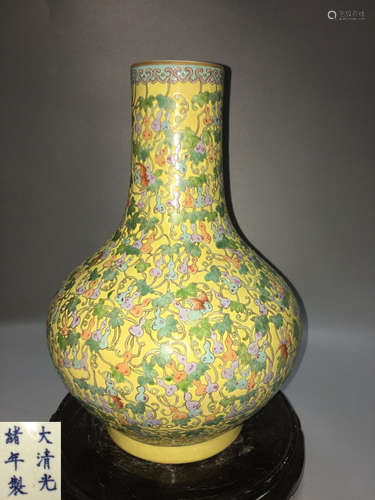 A YELLOW-GROUND FAMILLE ROSE GOURD PATTERN VASE