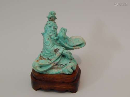 Sculpture en turquoise représentant un moine assis...