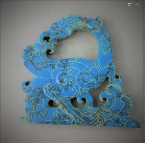 A Chinese archaic turquoise carved dragon-formed pendant