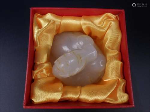 A Chinese hetian white jade carved camel with box