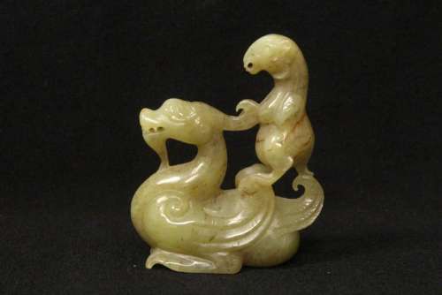 A Chinese archaic jade carved auspicious beast