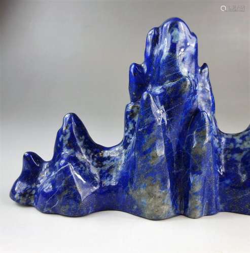 A Chinese Qing dynasty lapis lazuli carved mountain motif