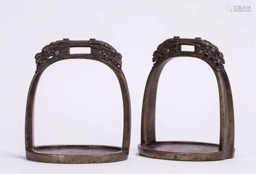 A PAIR OF BRONZE HORSE SADDLE FOOT STAND