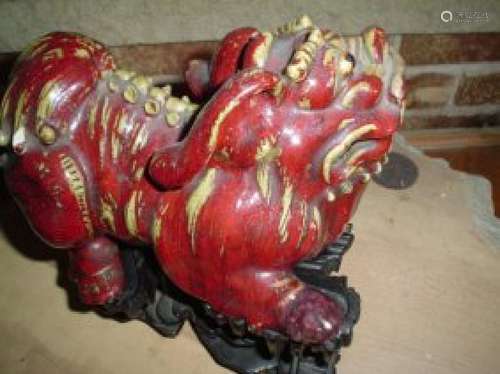 Chinese ming lion on the wood stand