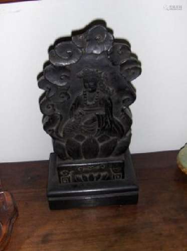 a black northern wei god carving.