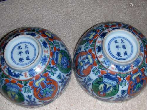 a pair of antique famille verte bowls.