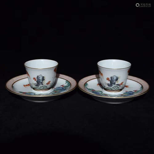 A PAIR OF WAVE PATTERN FAMILLE ROSE CUPS WITH saucers