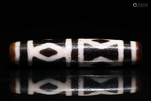 A TIBETAN SIX-EYE DZI BEAD