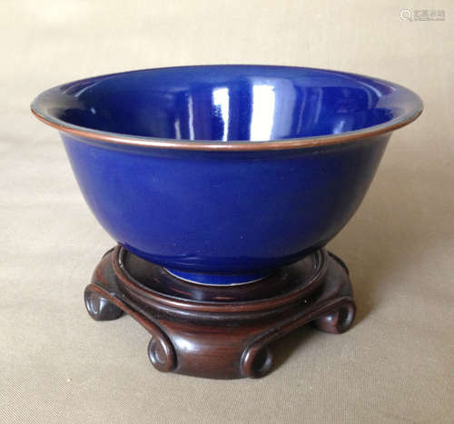 A BLUE GLAZE BOWL WITH ROSEWOOD PEDESTAL