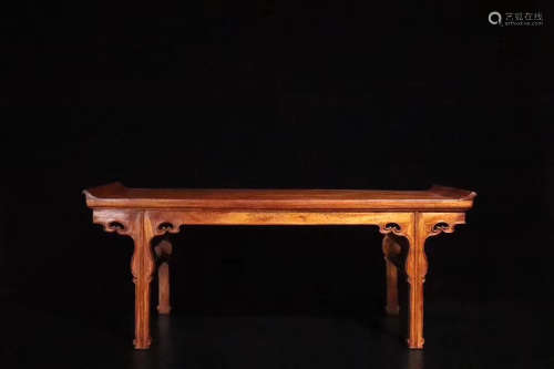 AN OLD YELLOW ROSEWOOD TABLE
