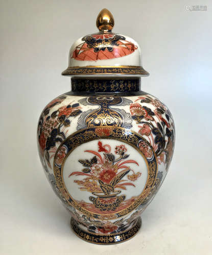 A JAPANESE MULTI COLORED GILT HELMET-SHAPED JAR