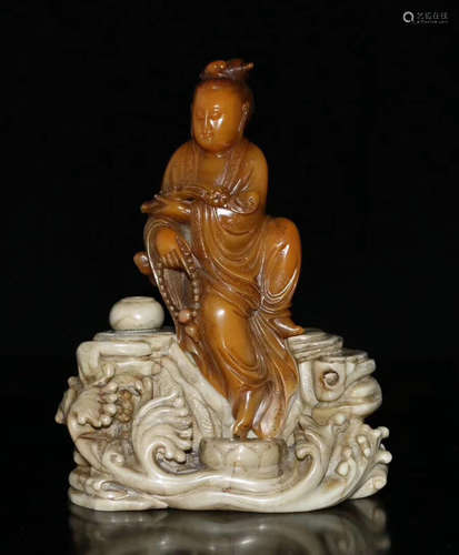 A YELLOW SOAPSTONE GUANYIN STATUE