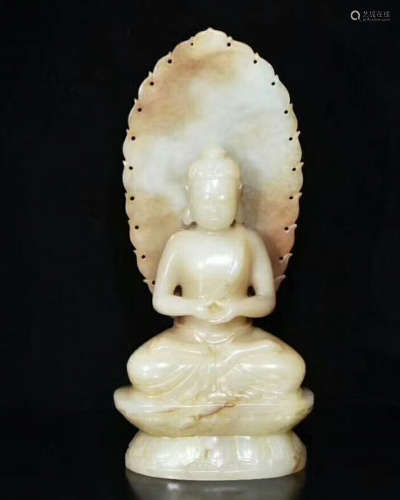 A HETIAN JADE CARVED BUDDHA FIGURE