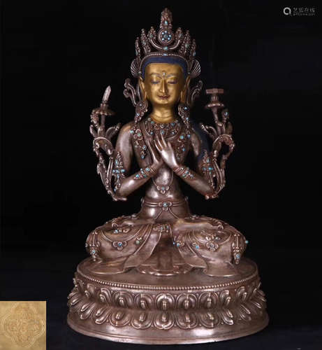 A SILVER MOLDED TIBETAN BUDDHA STATUE