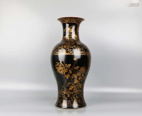 A chinese black glaze gold painting bottle