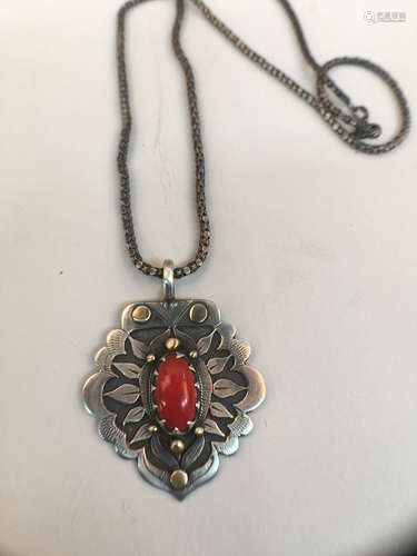 A 925 silver pendant set coral