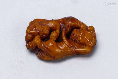 Old beeswax carving of lion