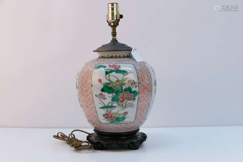 A chinese famille rose lamp with rosewood base