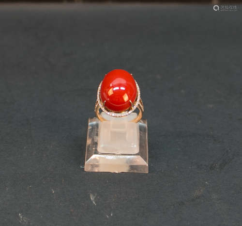 A red coral ring set diamond