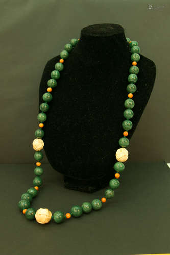 A gray jade ivory bead necklace