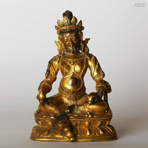 CHINESE GILT BRONZE FIGURE OF JAMBHALA