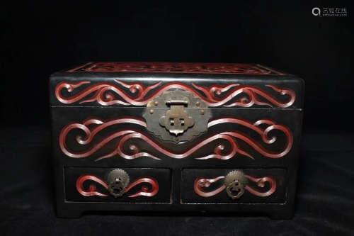 A RED WOOD JEWELRY BOX