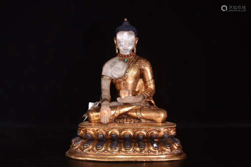 A CRYSTAL AND GILT BRONZE MOLDED BUDDHA STATUE