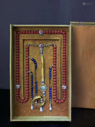 A STRING OF AGILAWOOD COURT BEADS