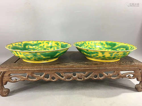 A PAIR OF YELLOW BASE GREEN GLAZE DRAGON PLATES