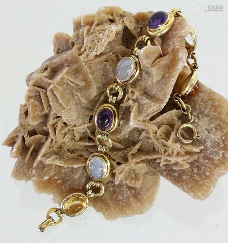 A BRACELET Gilt silver with various gemstones. 19