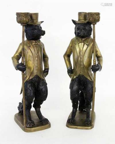 A PAIR OF CANDLESTICKS WITH ANTHROPOMORPHIC DOGS